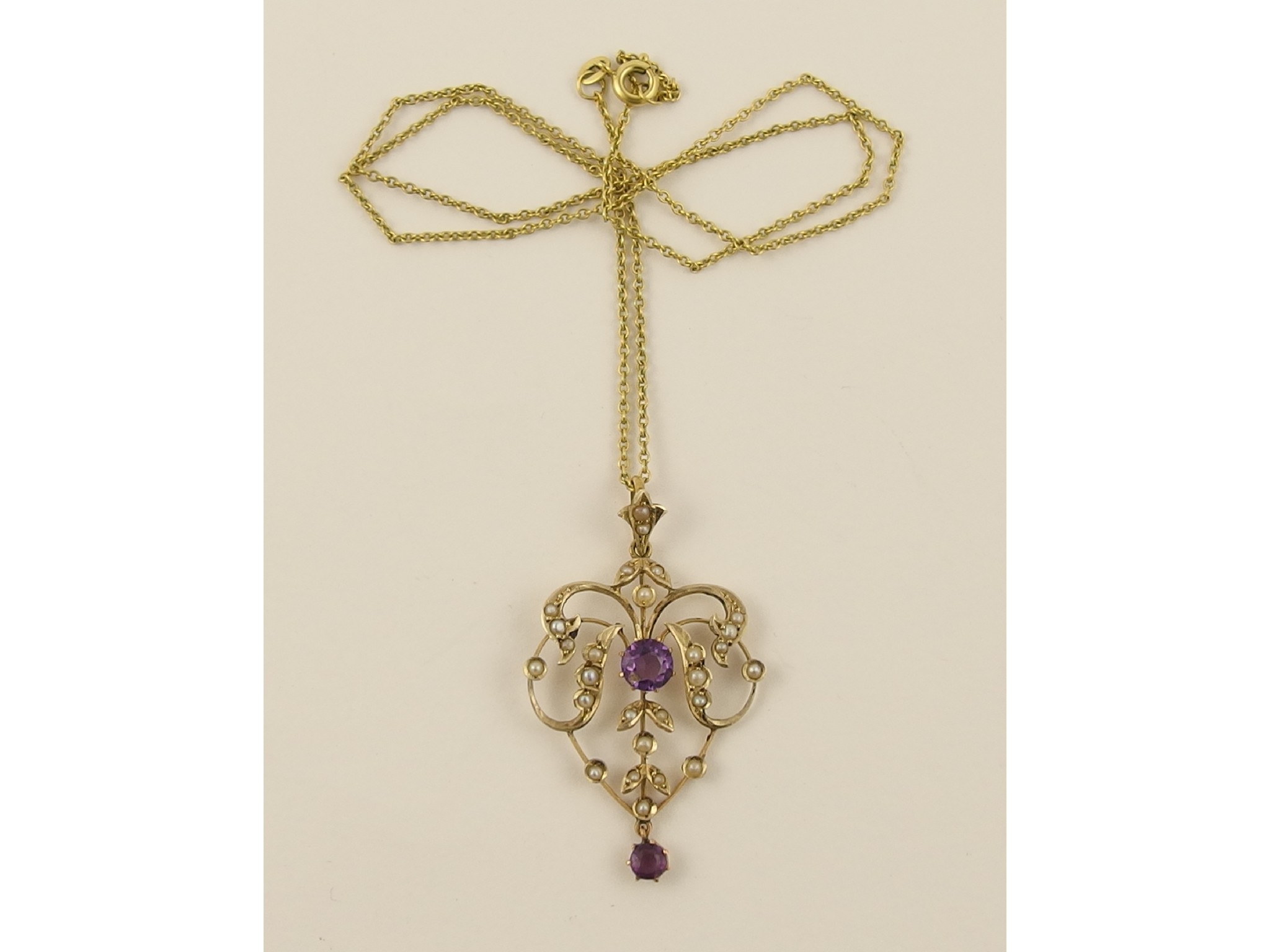 Appraisal: A ct Edwardian pendant set with amethysts and split pearls