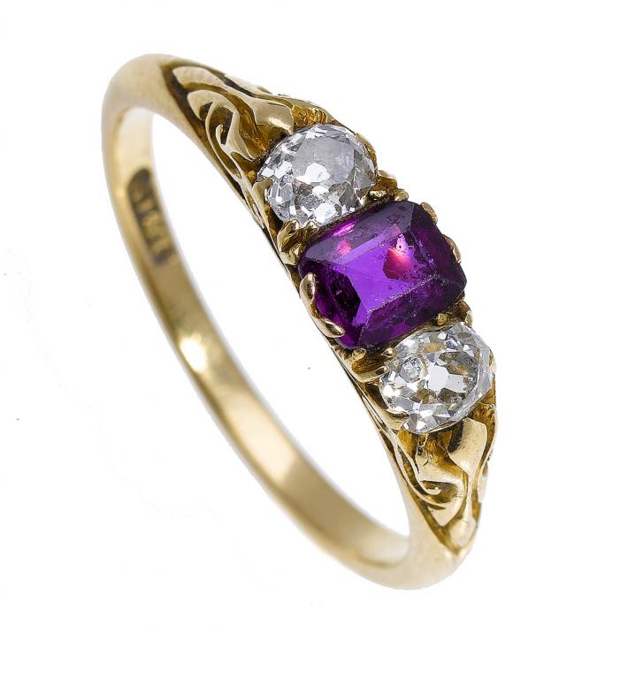 Appraisal: A RUBY AND DIAMOND RING the step cut ruby flanked