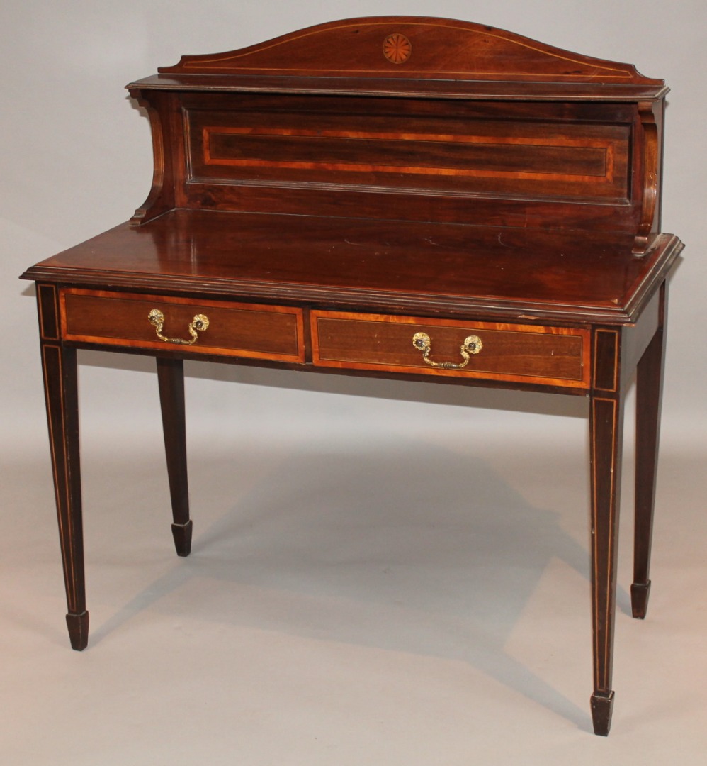 Appraisal: An Edwardian mahogany and boxwood strung writing desk with a