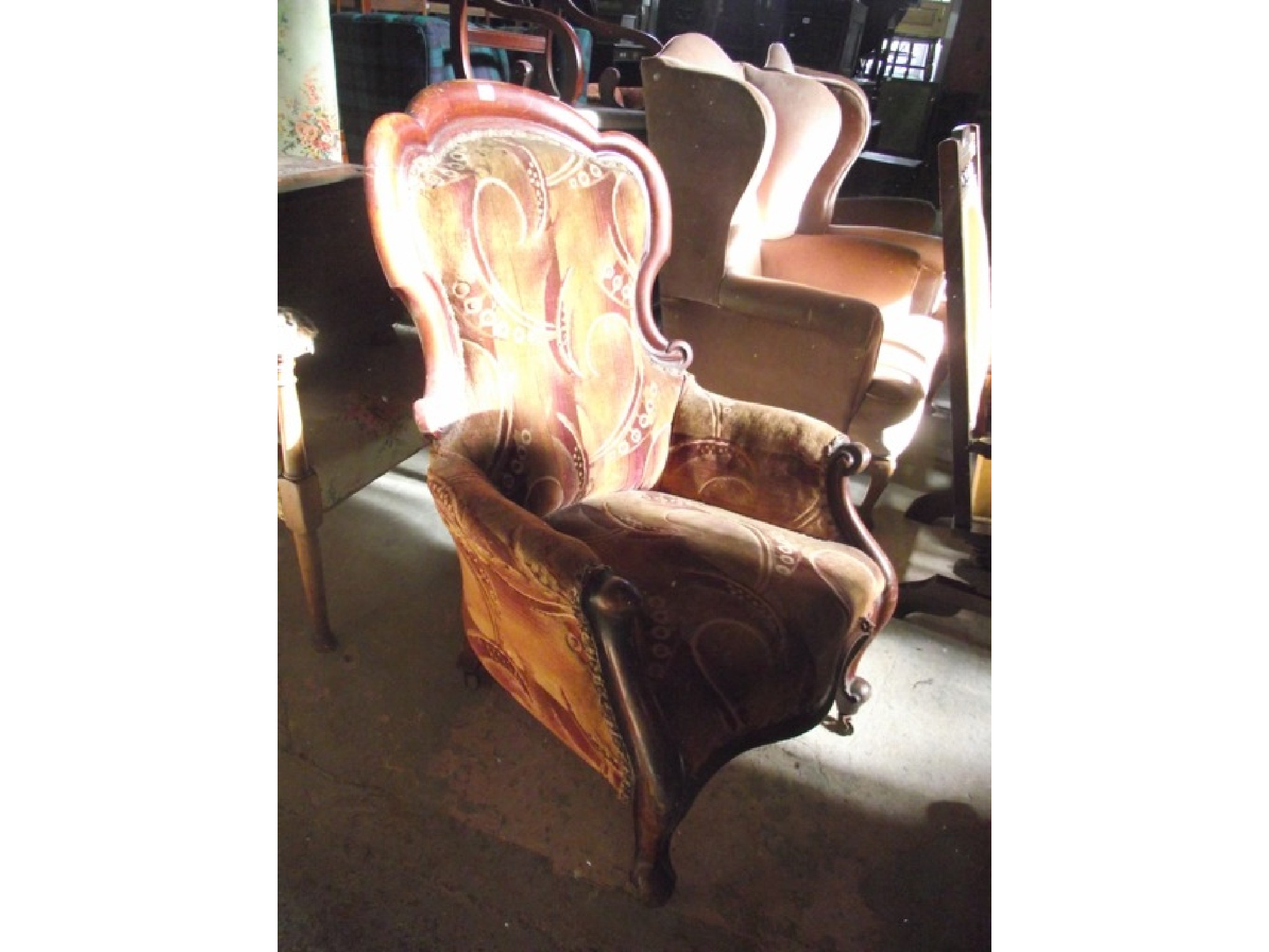 Appraisal: A Victorian drawing room chair with serpentine upholstered seat back