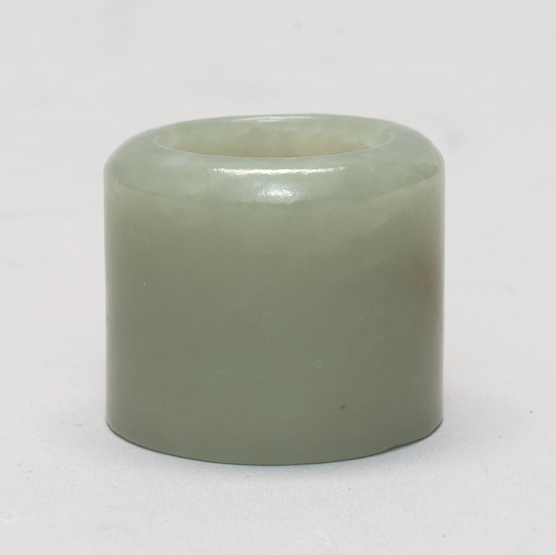 Appraisal: CELADON JADE ARCHER'S RING th th CenturyIn simple cylinder form