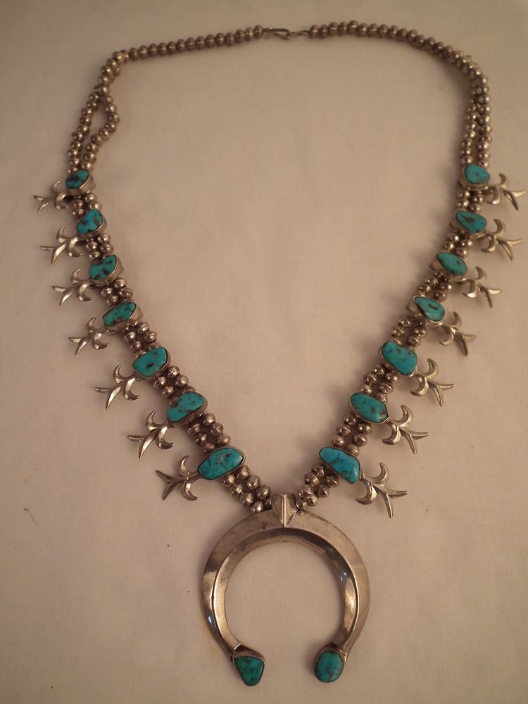 Appraisal: NAVAJO SILVER SQUASH BLOSSOM NECKLACE Navajo pawn sterling silver squash