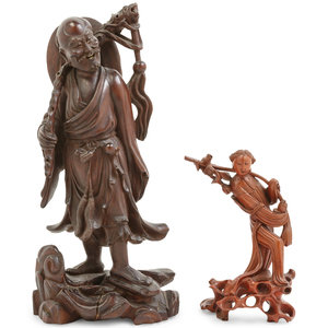 Appraisal: Two Chinese Carved Hardwood Figures of Immortals the first carrying