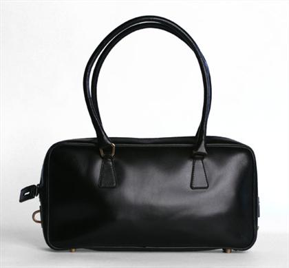 Appraisal: Two Prada handbags One small black calfskin top-handle bag lined