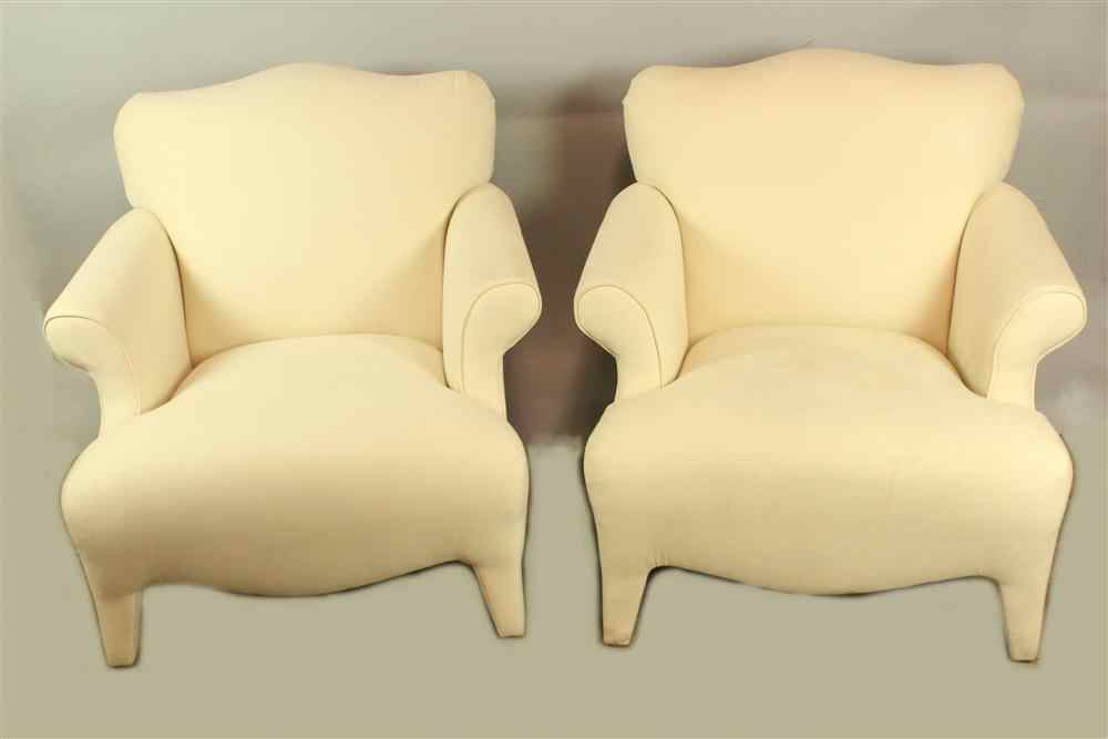 Appraisal: PAIR OF FAUX CREAM SUEDE ARM CHAIRS each having an