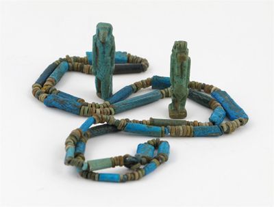 Appraisal: An Egyptian bead necklace with twenty-five turquoise faience beads and