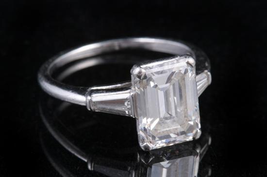 Appraisal: SIGNED CARTIER PLATINUM AND DIAMOND RING Emerald-cut diamond weighing approx