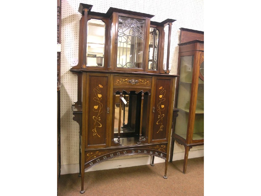 Appraisal: An Art Nouveau inlaid mahogany display cabinet tall raised back