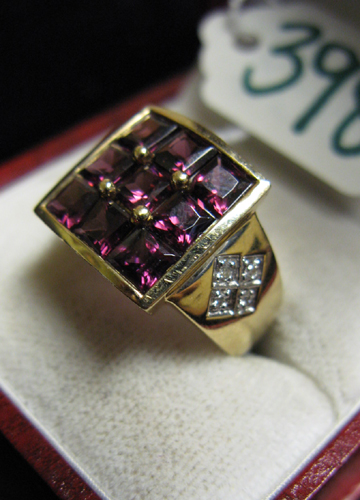 Appraisal: GRAPE TOURMALINE DIAMOND AND FOURTEEN KARAT GOLD RING nine square-cut