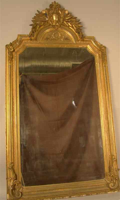 Appraisal: CONTINENTAL NEOCLASSICAL GILT MIRROR late th century with arched molded