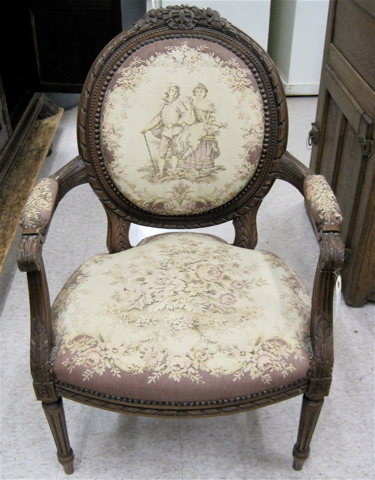 Appraisal: LOUIS XVI STYLE ARMCHAIR with carved walnut frame medallion back