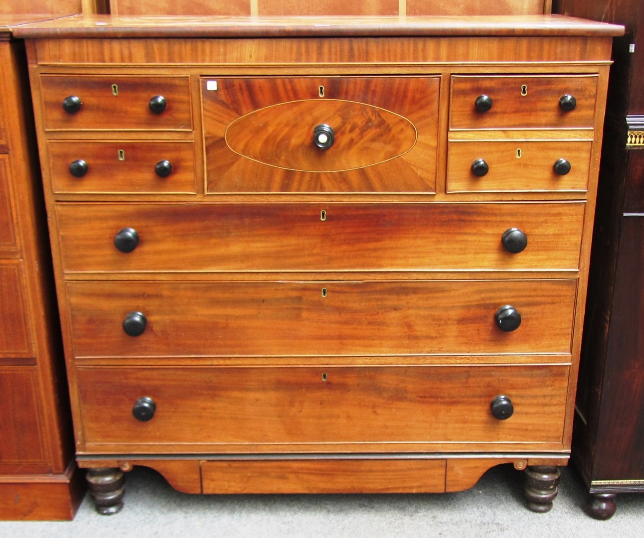 Appraisal: A th century Scottish inlaid mahogany chest with four short