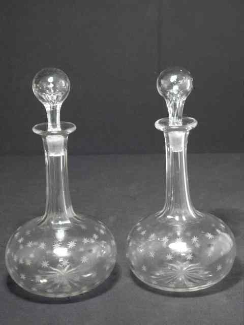 Appraisal: Pair of th century hand-blown star cut glass decanters Each