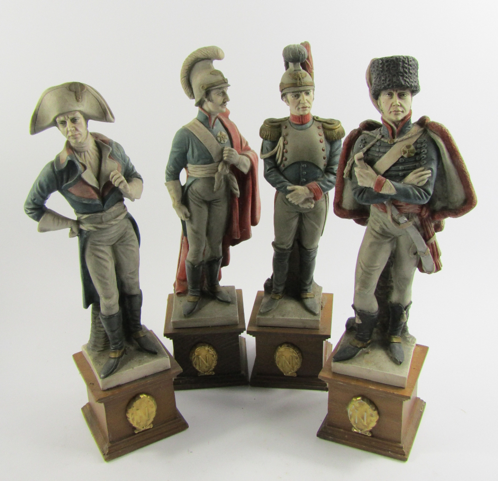 Appraisal: Four Capodimonte figures of Napoleonic soldiers each raised on wooden