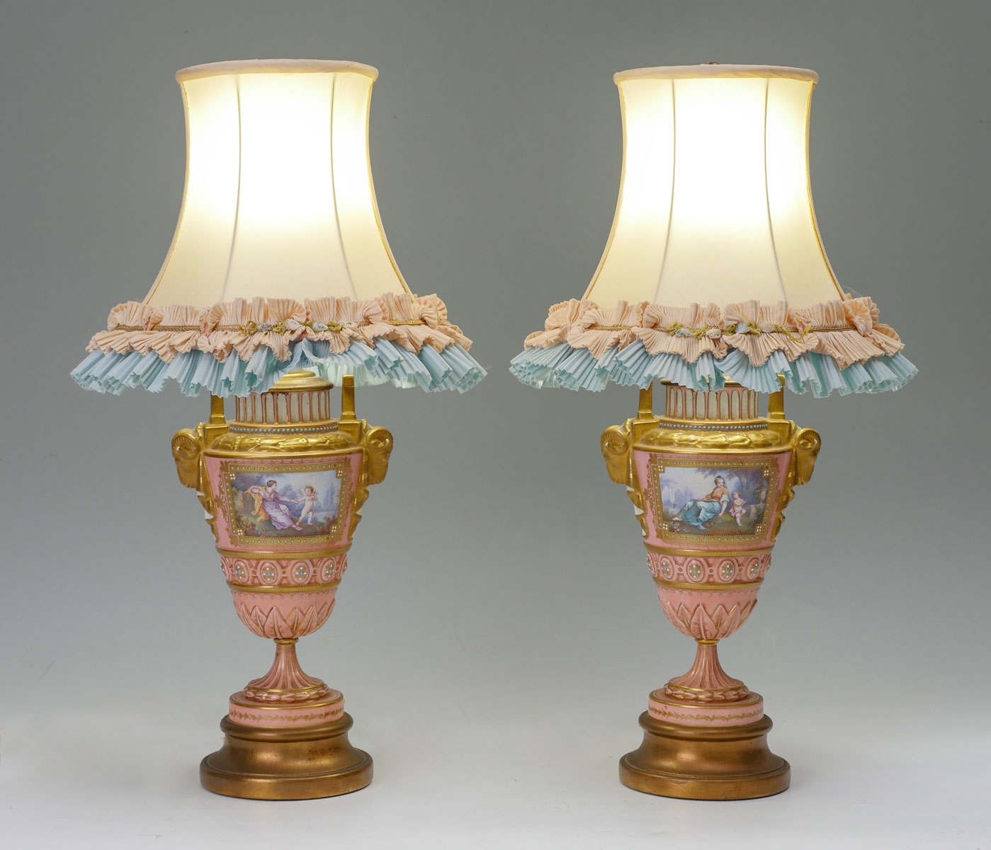 Appraisal: PAIR OF PINK SEVRES LAMPS Pink ground Sevres urn lamps