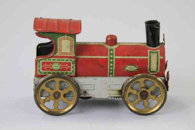 Appraisal: OROBR LOCOMOTIVE Lithographed tin bright red grey frame gold finish