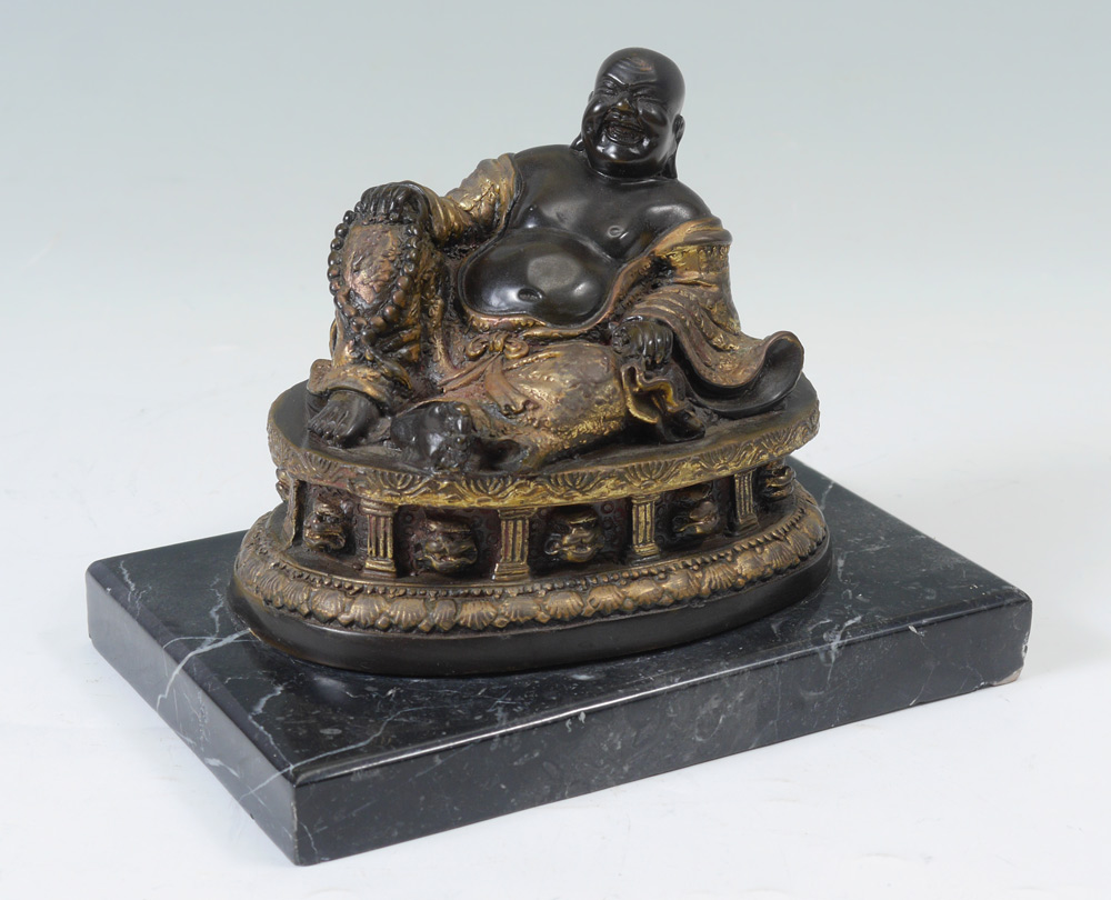 Appraisal: BRONZE BUDDHA ON MARBLE BASE Figure of reclining bronze Buddha