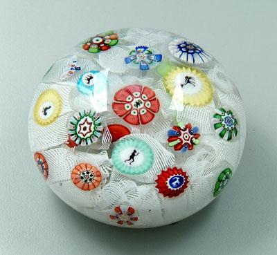 Appraisal: Baccarat paperweight loosely packed flowers on latticino ground silhouettes of