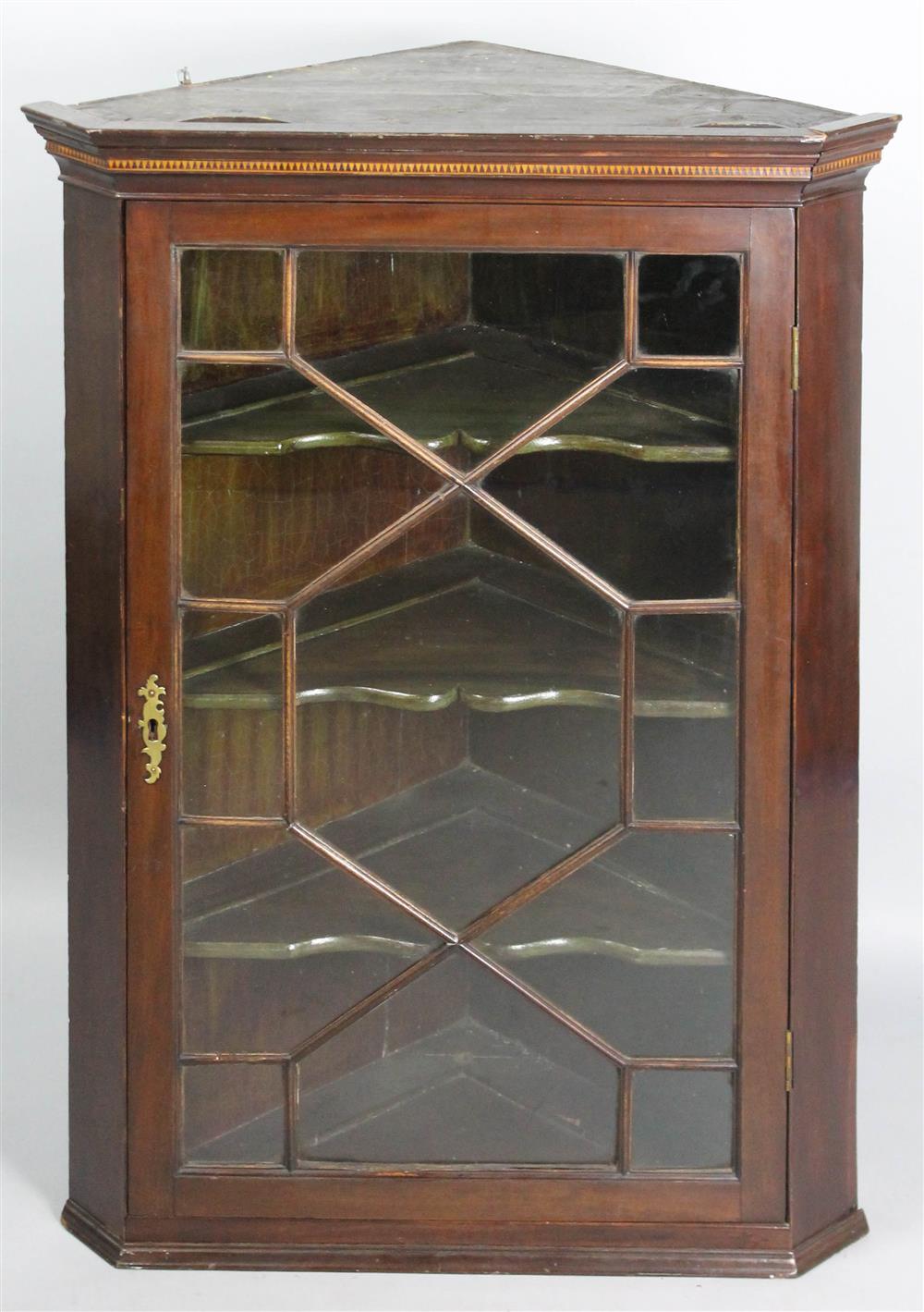 Appraisal: GEORGIAN INLAID MAHOGANY HANGING CORNER CUPBOARD having a molded cornice