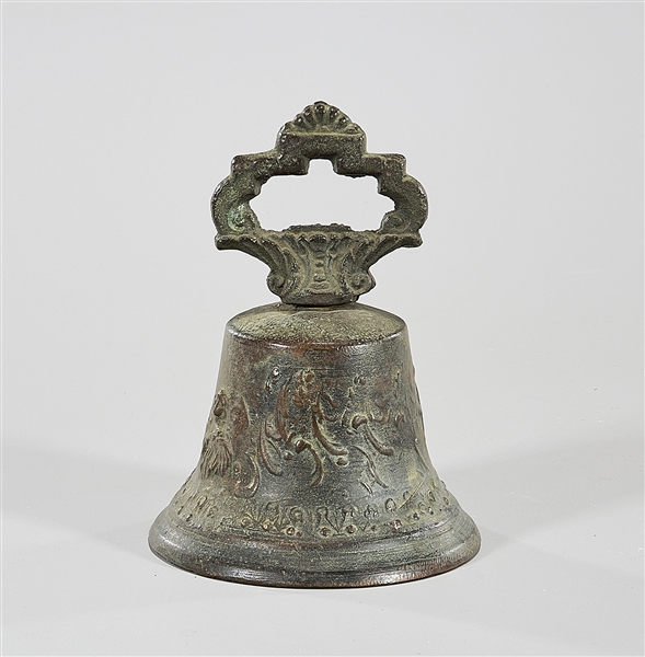 Appraisal: Antique patinated cast iron bell depicting angel-like figures the letters