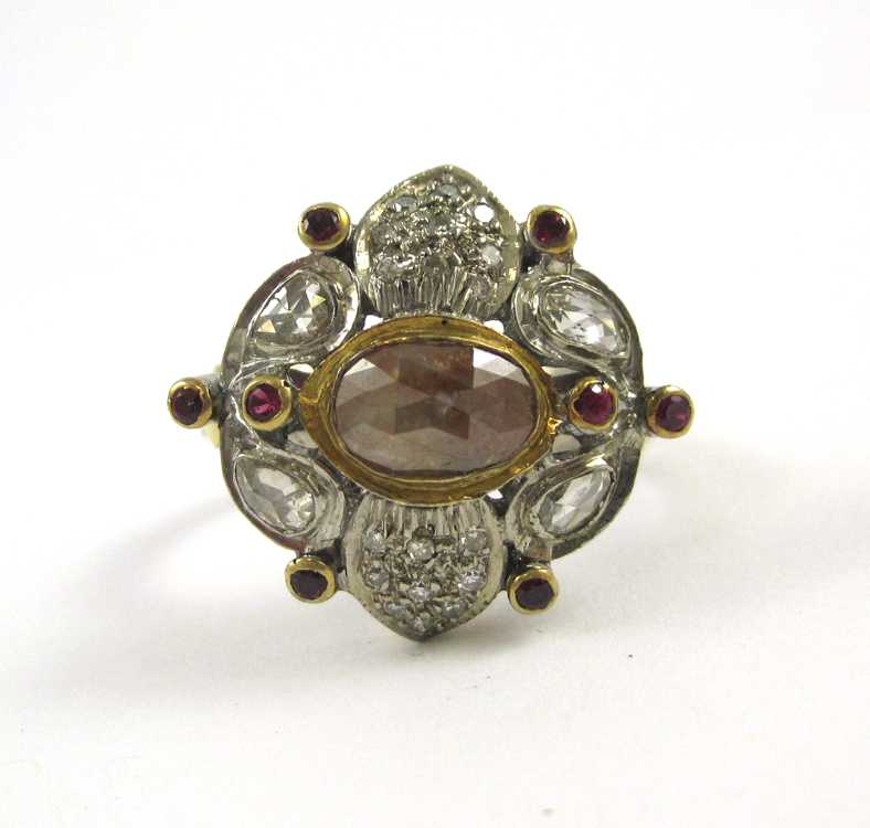 Appraisal: INDIA DIAMOND RUBY SILVER AND YELLOW GOLD RING The sterling