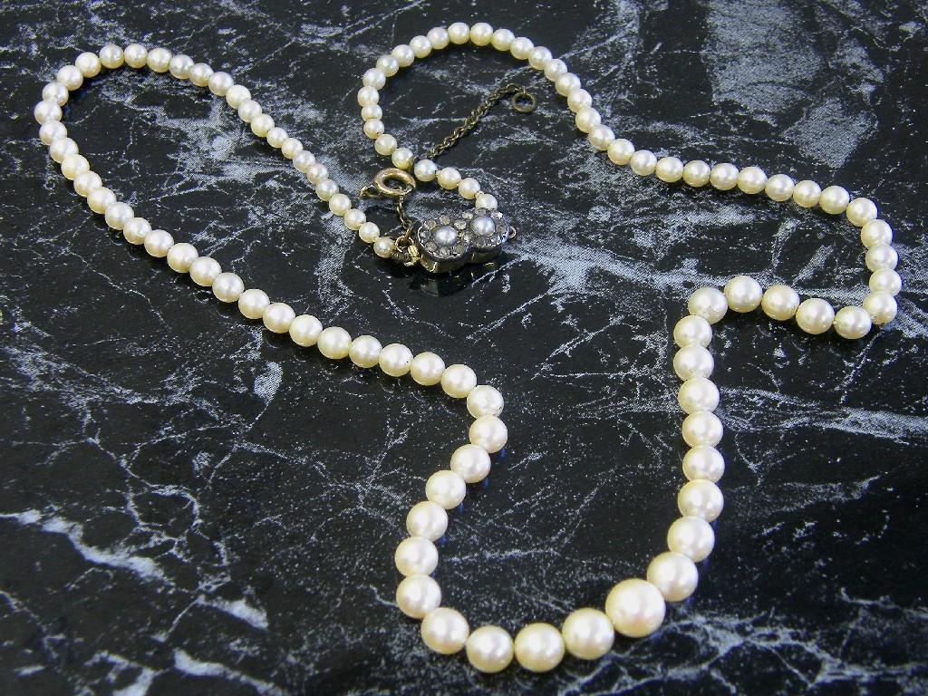 Appraisal: Cultured pearl single string necklet with a cluster rose cut