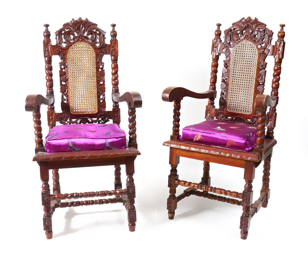 Appraisal: PAIR CARVED ARM CHAIRS Foliate carved and pierced back with