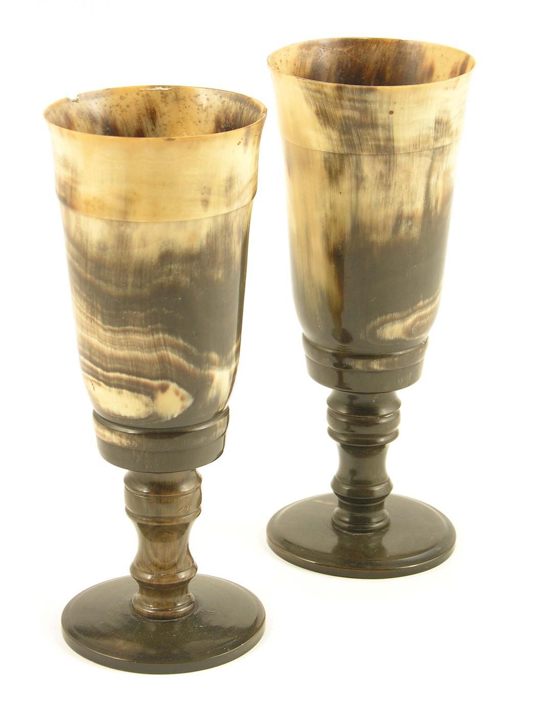 Appraisal: A pair of th century horn beakers