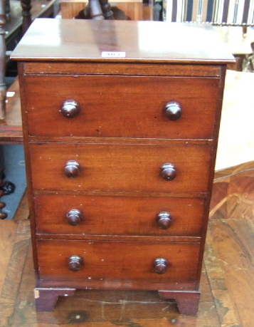 Appraisal: A Victorian mahogany apprentice chest with four drawers and turned