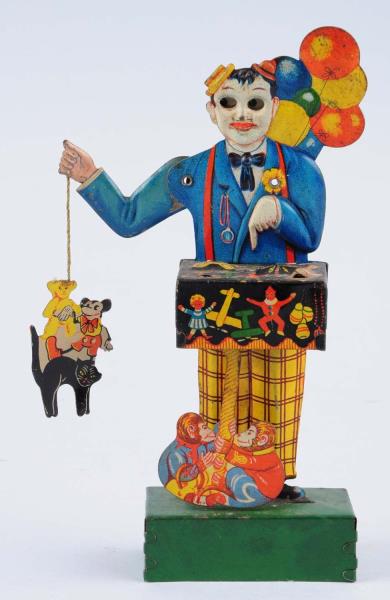 Appraisal: German Tin Wind-up Balloon Vender Toy When in operation monkey's