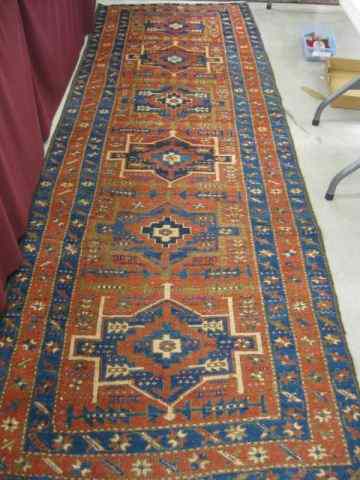 Appraisal: Heriz Persian Handmade Runner primarily reds blues ivory geometric '