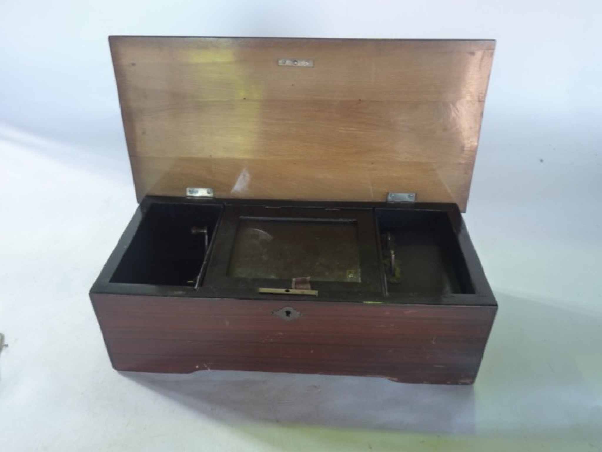 Appraisal: A late th century cylinder music box set within a