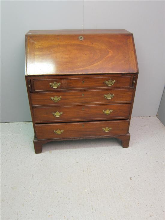 Appraisal: George III mahogany bureau with a fitted interior over four