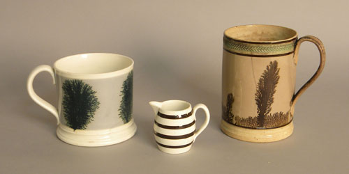 Appraisal: Two mocha mugs with seaweed decoration together with a creamer