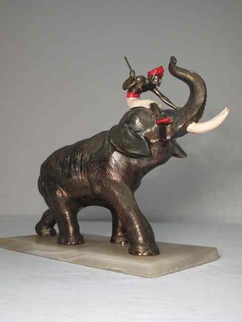 Appraisal: Spelter sculpture depicting a man riding an elephant with a