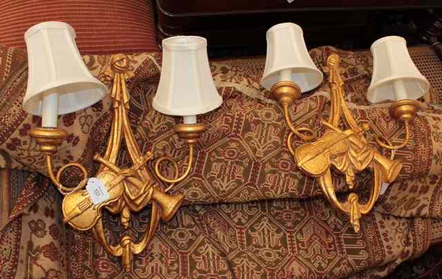 Appraisal: A PAIR OF GILT TWO BRANCH WALL LIGHTS with tied