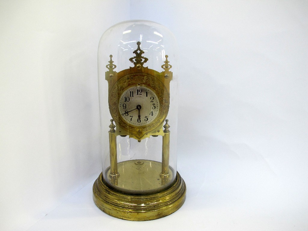 Appraisal: Brass mantle clock with relief decoration under a glass dome