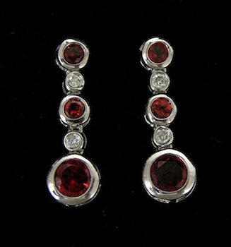 Appraisal: A Pair of Garnet and Diamond Earrings k white gold