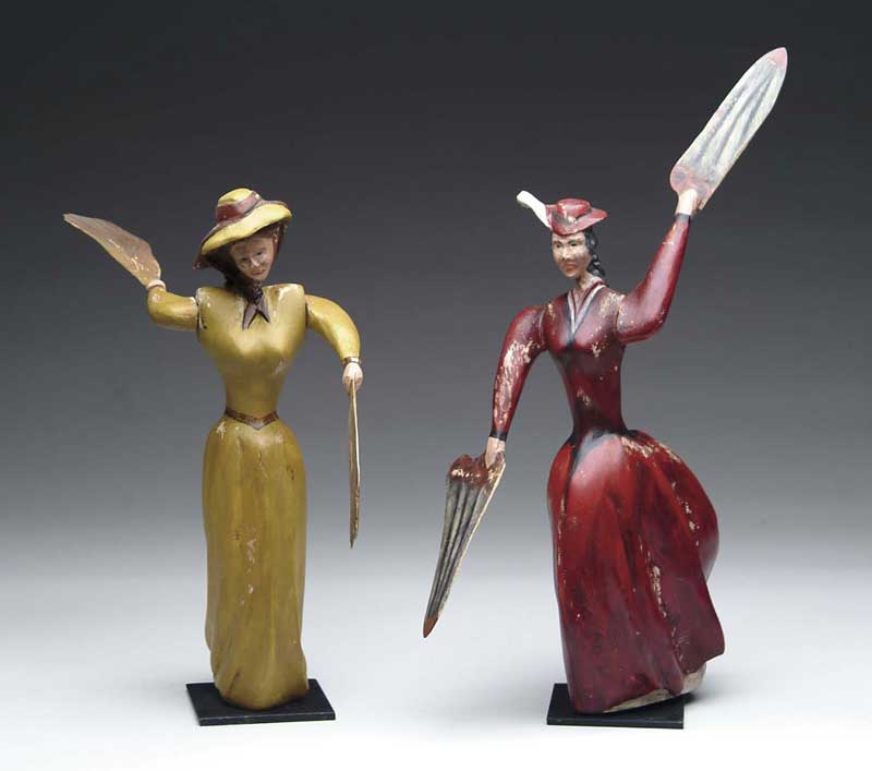 Appraisal: OUTSTANDING PAIR OF FOLK ART CARVED WOOD LADY WHIRLIGIGS Shows