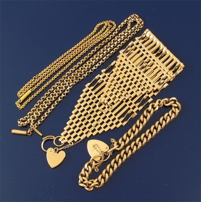 Appraisal: A wide gold gate link bracelet A gold curb link