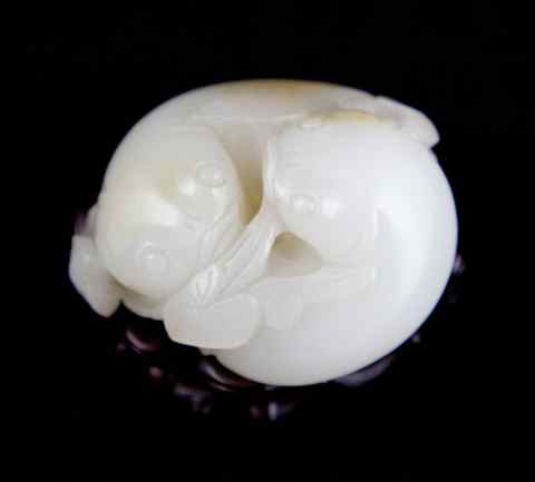 Appraisal: CHINESE WHITE JADE TWIN CATFISH WITH STAND carved as two