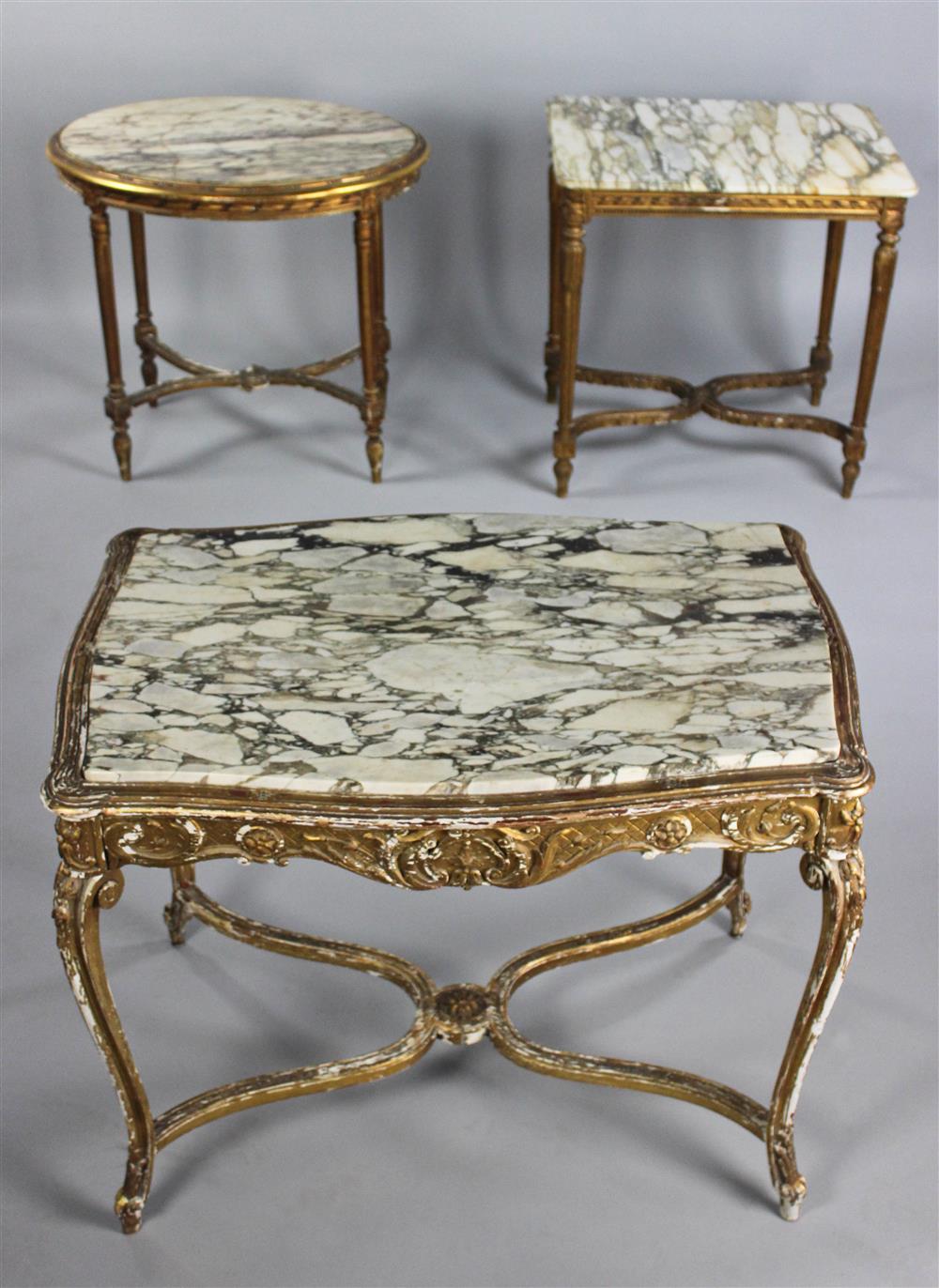 Appraisal: THREE CARVED GILTWOOD AND MARBLE TOP TABLES the larger rectangular