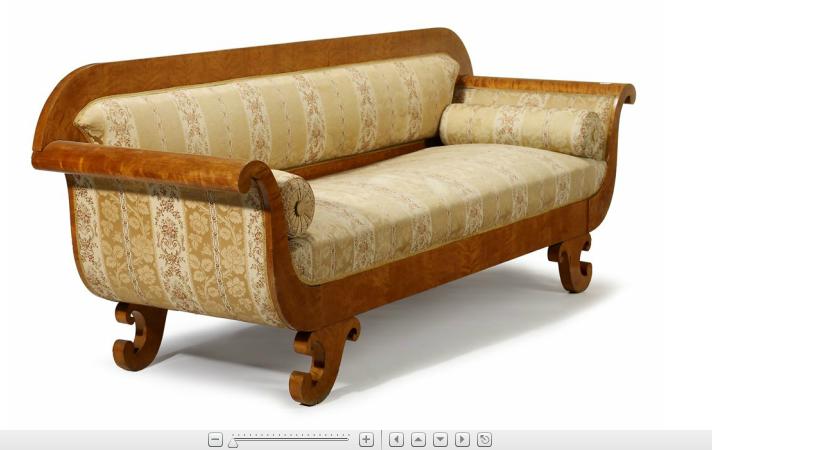 Appraisal: Biedermeier satinwood sofa The rounded rectangular padded back continuing to