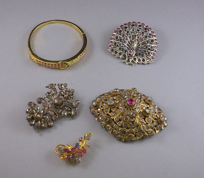 Appraisal: Three Victorian Costume Brooches together with a costume bangle bracelet