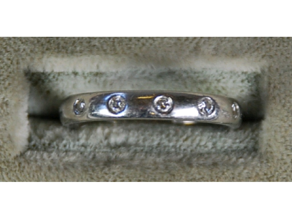 Appraisal: PLATINUM HALF ETERNITY RING swiss set with five small diamonds