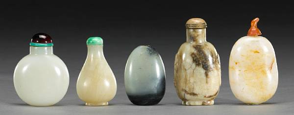 Appraisal: A group of five jade snuff bottles One carved in