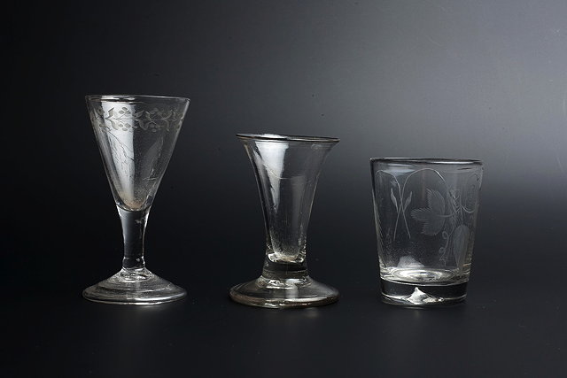 Appraisal: A SMALL WINE GLASS c the conical bowl engraved with