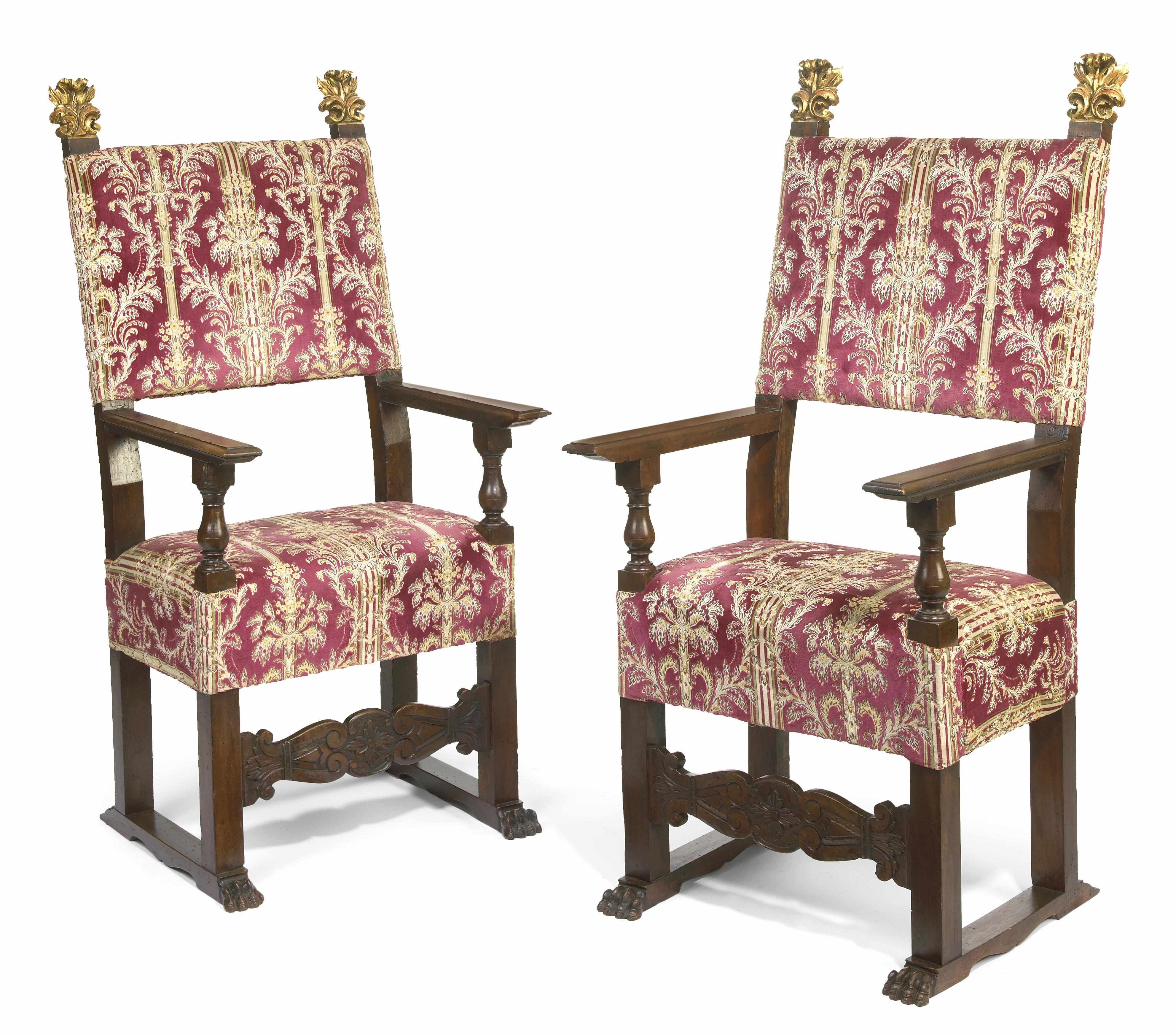 Appraisal: A pair of Italian Baroque parcel gilt walnut armchairs incorporating