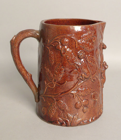 Appraisal: Earthenware pitcher th c with relief decoration of monkeys h