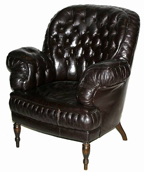 Appraisal: A Victorian black leather uhpolstered armchair